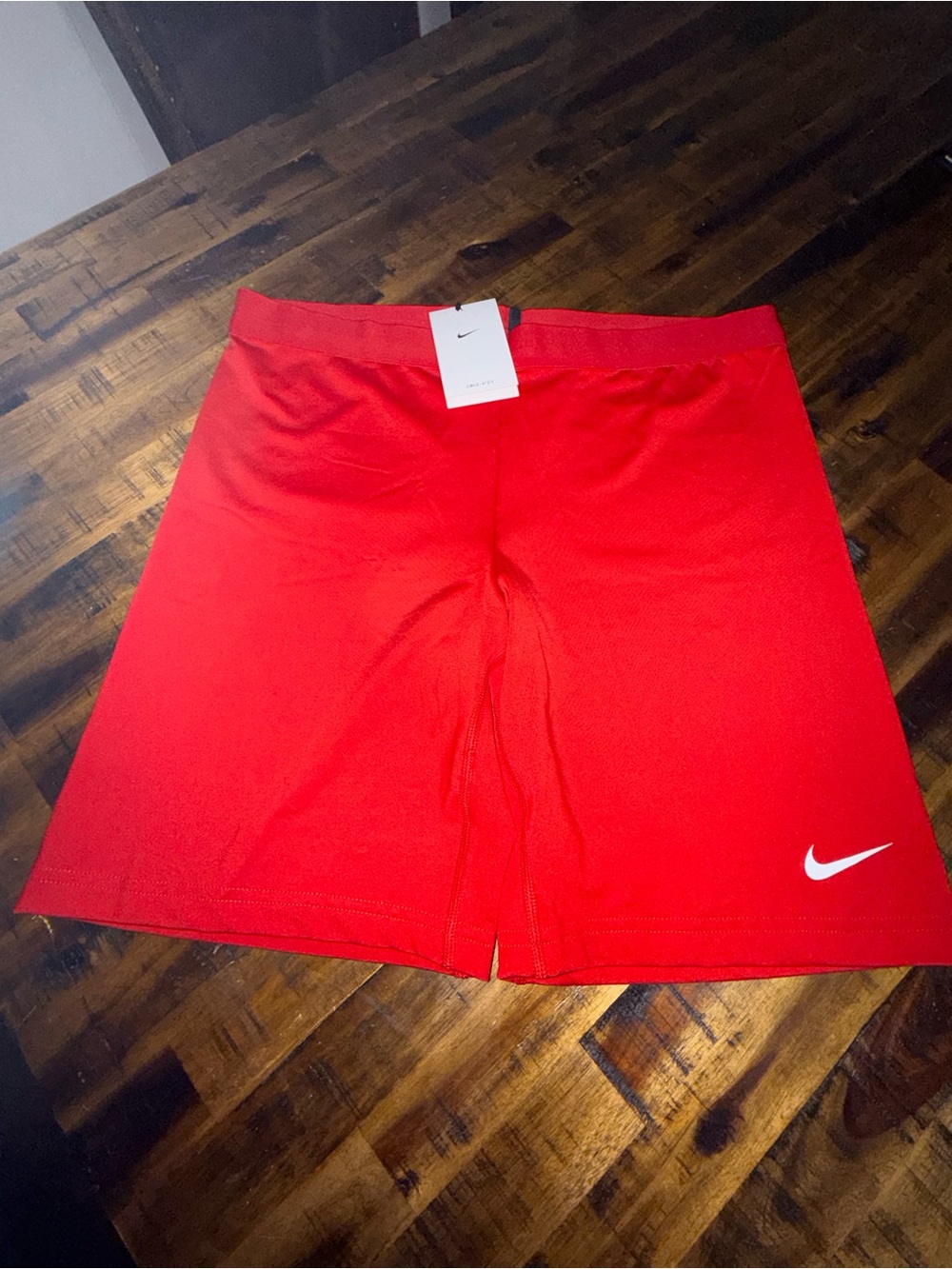 Nike Women's Bright Red Athletic Shorts with White Swoosh